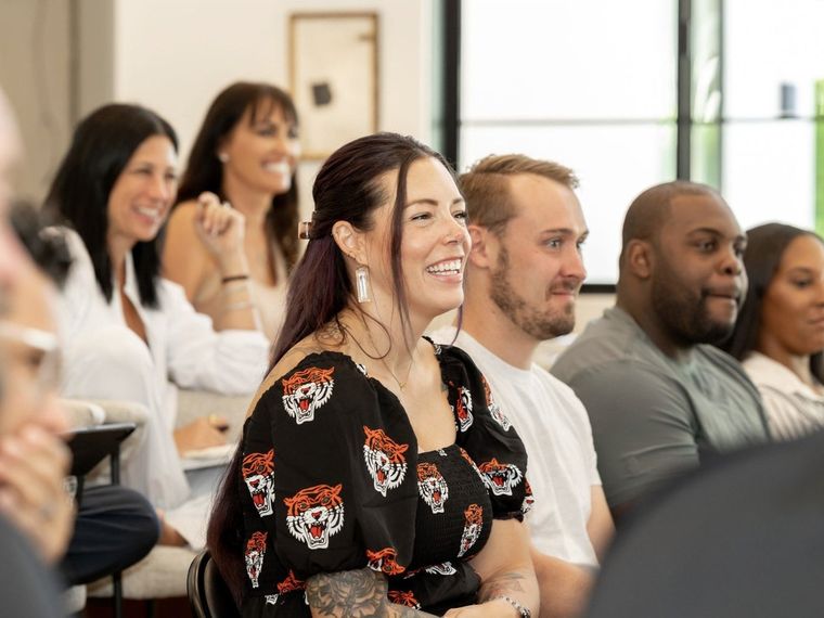 Upgrade members laughing in a session