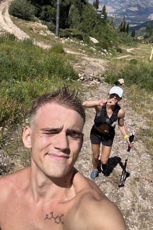 Spring hiking a mountain trail with her son